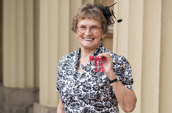 Former England cricketer Enid Bakewell poses with her MBE medal after an Investiture ceremony at Buckingham Palace on February 13, 2019 in London, England. (Feb. 12, 2019 - Source: Dominic Lipinski/Getty Images Europe)