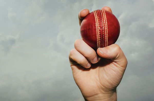 Man holding cricket ball in his hand. PC: piqsels.com