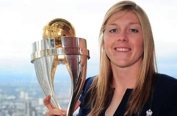 Heather Knight keeps a tight hold on the Women’s World Cup trophy. Photograph: Harry Trump-IDI/IDI via Getty Images