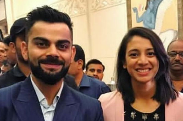 Smriti Mandhana with Virat Kohli at an event.