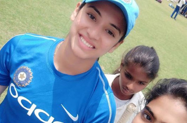 Smriti Mandhana with young aspiring female cricketers