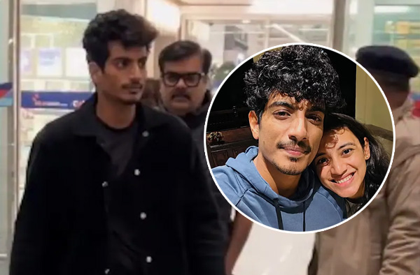 Palash emerged from the terminal, flanked by his mother and family members. Instead of shying away from the cameras, he chose to remain silent.