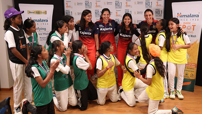 RCB Stars Shreyanka Patil, Richa Ghosh, Radha Yadav and Smriti Mandhana interacting with the Winners and Runner-ups of Himalaya 1der Woman Cricket Tournament